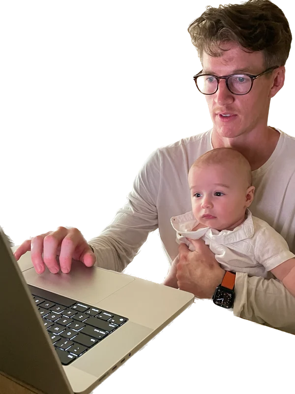 Father and son working at laptop